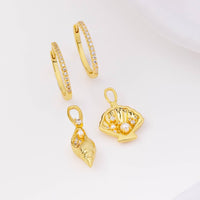 Sundaze Shell Gold Huggie Earrings | Wanderlust + Co