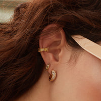 Constellation Black & Gold 7mm Baby Huggie Earrings | Wanderlust + Co