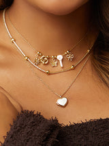 Bow Gold Drop Charm | Wanderlust + Co