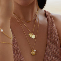 Seashell Gold Locket Necklace | Wanderlust + Co 