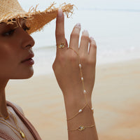 To The Sea Gold Hand Chain | Wanderlust + Co 